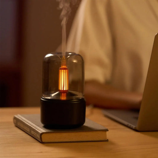 JLD Candlelight Aroma Diffuser emitting soft candlelight glow with essential oil mist—compact, stylish, and perfect for calming room ambiance and relaxation