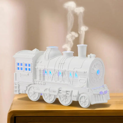 JLD Locomotive Diffuser emitting scented mist with steam puff effect and ambient lighting—designed like a classic train engine for stylish aromatherapy and cozy decor