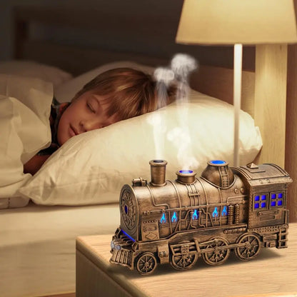 JLD Locomotive Diffuser emitting scented mist with steam puff effect and ambient lighting—designed like a classic train engine for stylish aromatherapy and cozy decor