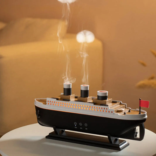 JLD Titanic Ship Diffuser releasing mist through steam chimneys with glowing LED lights—an elegant aromatherapy device combining classic design with modern wellness