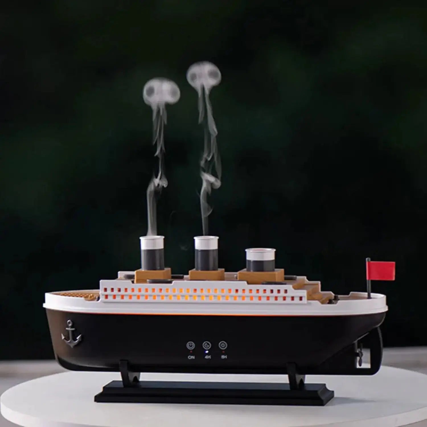 JLD Titanic Ship Diffuser releasing mist through steam chimneys with glowing LED lights—an elegant aromatherapy device combining classic design with modern wellness