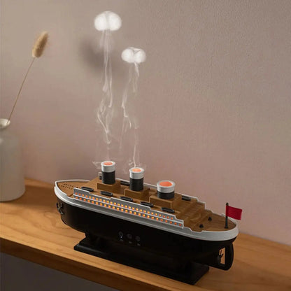 JLD Titanic Ship Diffuser releasing mist through steam chimneys with glowing LED lights—an elegant aromatherapy device combining classic design with modern wellness