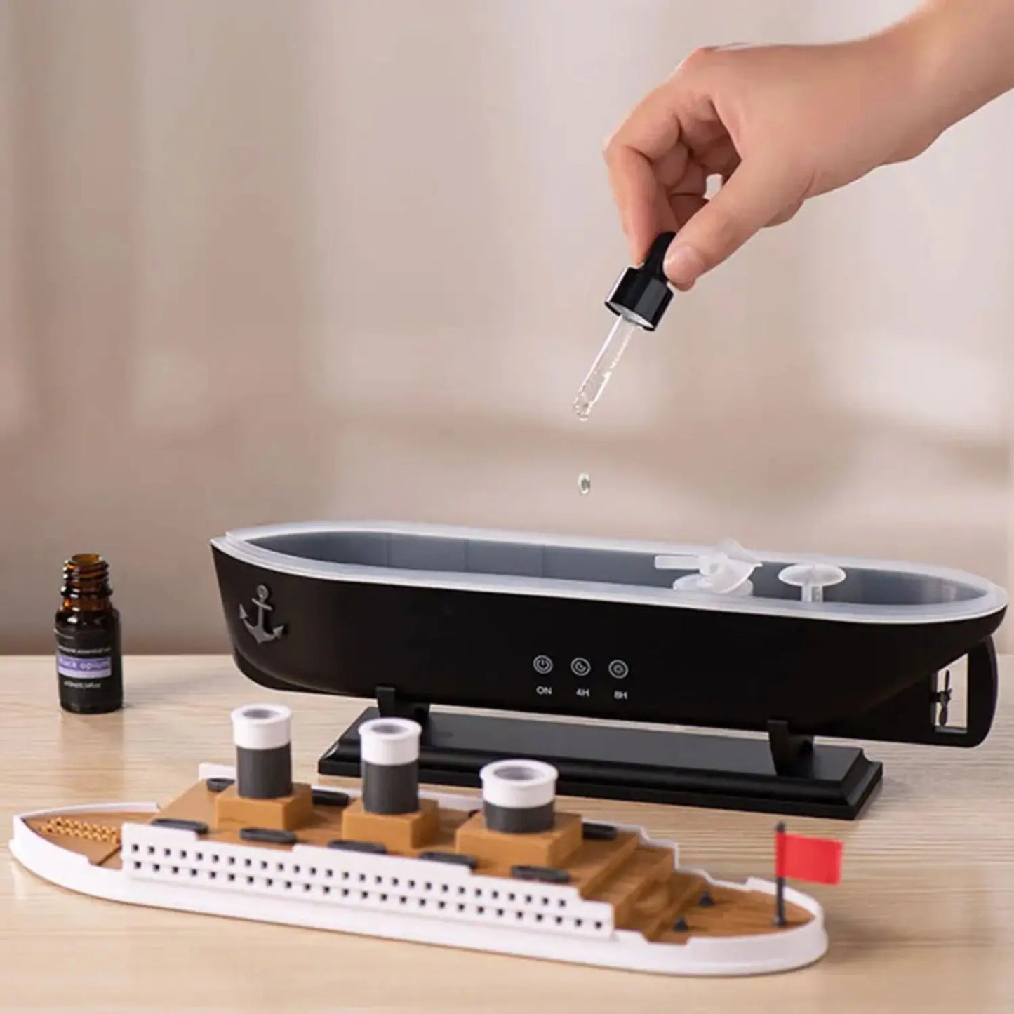 JLD Titanic Ship Diffuser releasing mist through steam chimneys with glowing LED lights—an elegant aromatherapy device combining classic design with modern wellness