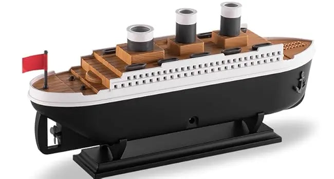 JLD Titanic Ship Diffuser releasing mist through steam chimneys with glowing LED lights—an elegant aromatherapy device combining classic design with modern wellness.